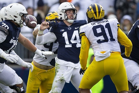 Aidan Hutchinson (97) and Taylor Upshaw (91)
