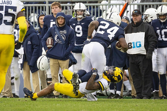 David Ojabo (55) and Vincent Gray (4)