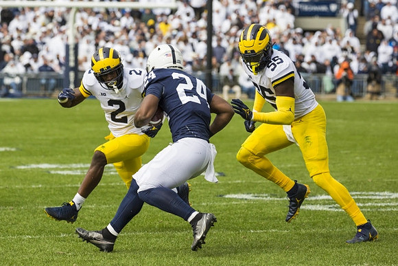 Brad Hawkins (2) and David Ojabo (55)