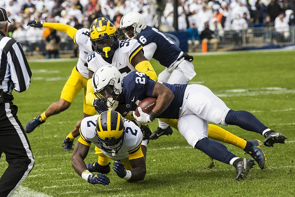 Brad Hawkins (2), David Ojabo (55), and Vincent Gray (4)