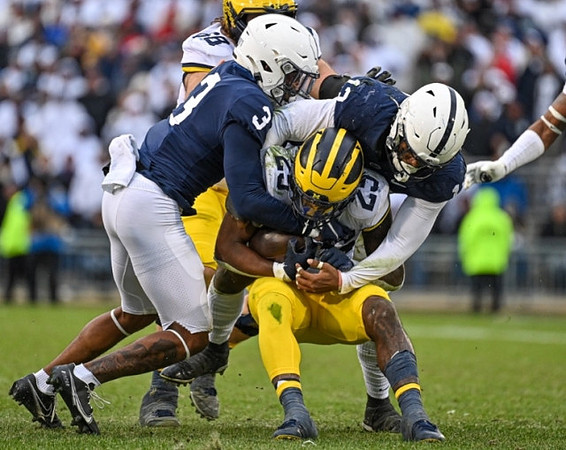 Andrew Vastardis (68) and Hassan Haskins (25)