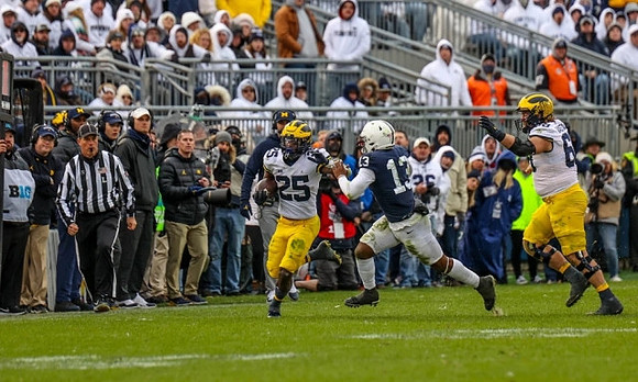 Hassan Haskins (25) and Andrew Vastardis (68)