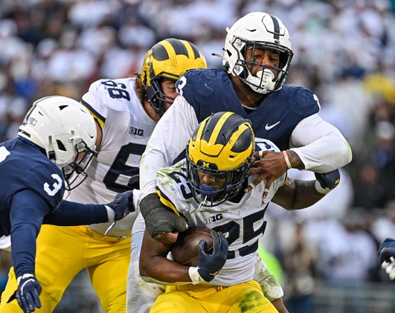 Andrew Vastardis (68) and Hassan Haskins (25)