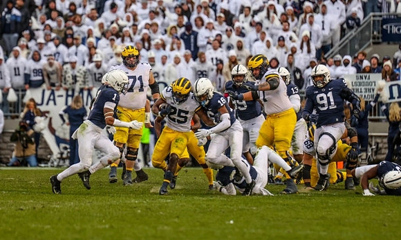 Andrew Stueber (71), Hassan Haskins (25), and Trevor Keegan (77)
