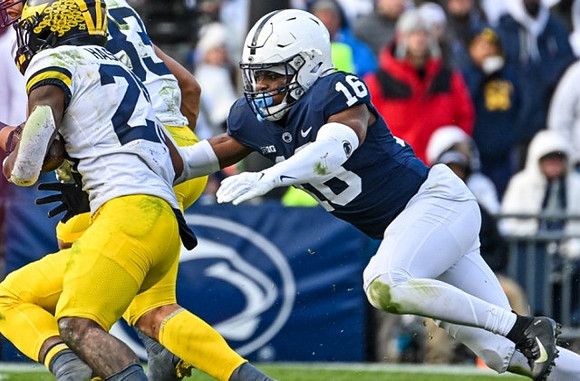 Hassan Haskins (25) and Erick All (83)