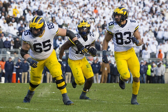 Zak Zinter (65), Hassan Haskins (25), and Erick All (83)