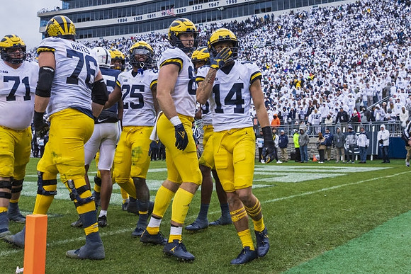 Andrew Stueber (71), Ryan Hayes (76), Hassan Haskins (25), Luke Schoonmaker (86), and Roman Wilson (14)