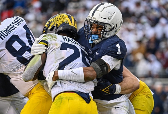 Joel Honigford (84) and Hassan Haskins (25)