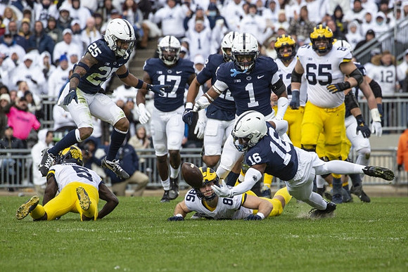 Mike Sainristil (5), Andrew Vastardis (68), Cade McNamara (12), and Zak Zinter (65)