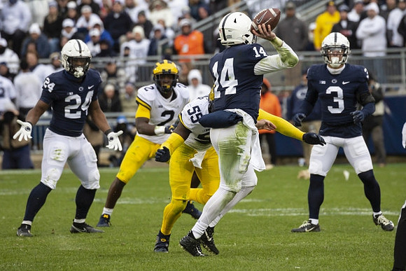 Brad Hawkins (2) and David Ojabo (55)
