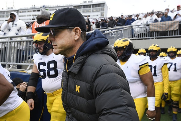 Andrew Vastardis (68) and Jim Harbaugh