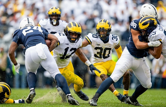 Josh Ross (12), Daxton Hill (30), and Junior Colson (25)