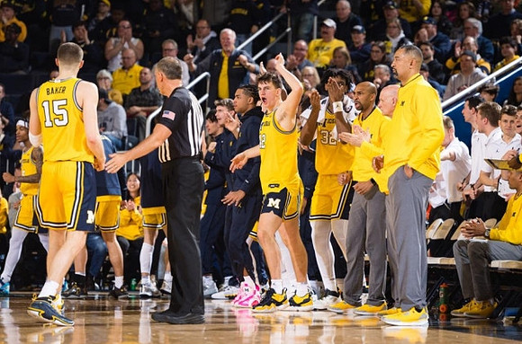 Joey Baker (15) and Michigan Team