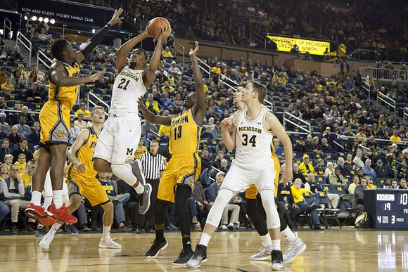 Zak Irvin (21) and Mark Donnal (34)