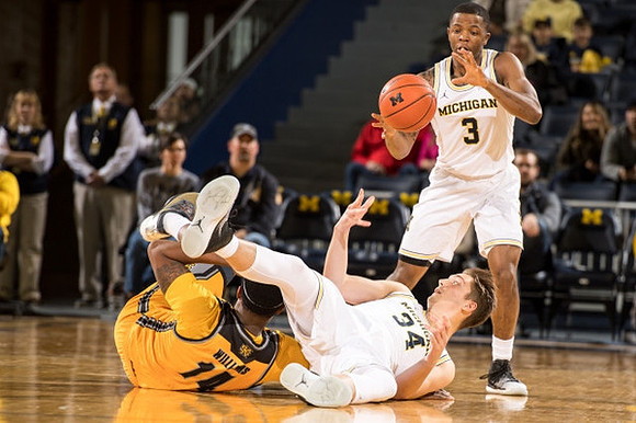 Mark Donnal (34) and Xavier Simpson (3)