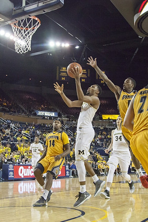 Muhammad-Ali Abdur-Rahkman (12), Zak Irvin (21), and Mark Donnal (34)