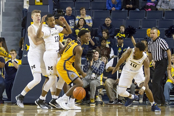 Moritz Wagner (13), Muhammad-Ali Abdur-Rahkman (12), and Derrick Walton Jr. (10)