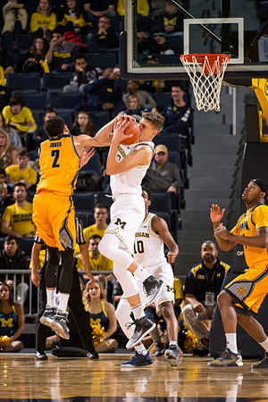 Moritz Wagner (13) and Derrick Walton Jr. (10)