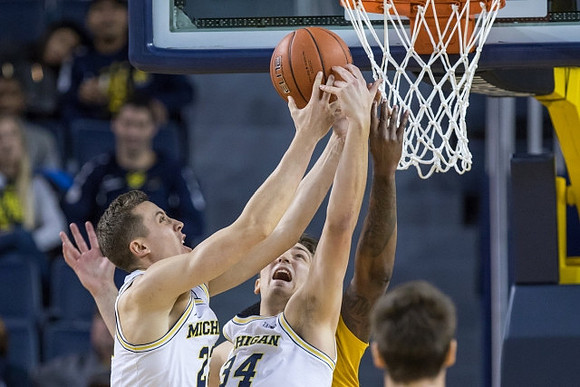 Duncan Robinson (22) and Mark Donnal (34)