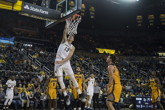 Muhammad-Ali Abdur-Rahkman (12), Moritz Wagner (13), and D.J. Wilson (5)