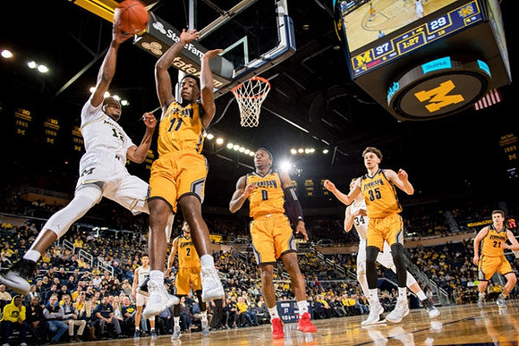 Muhammad-Ali Abdur-Rahkman (12) and Mark Donnal (34)