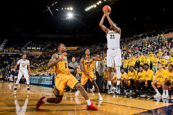 Muhammad-Ali Abdur-Rahkman (12) and Zak Irvin (21)