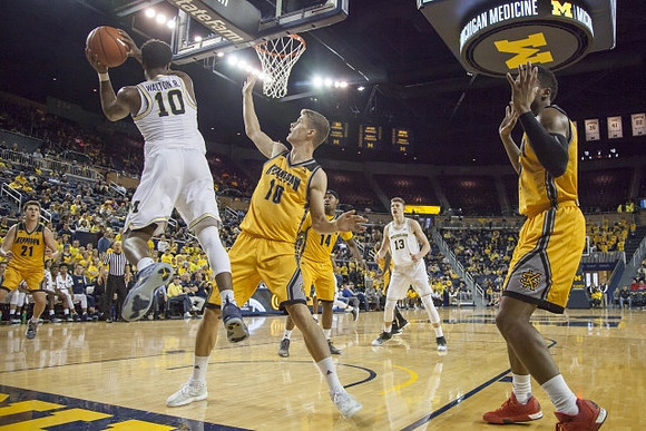 Derrick Walton Jr. (10) and Moritz Wagner (13)