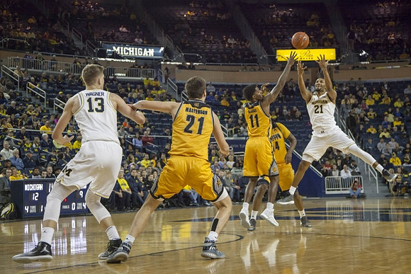 Moritz Wagner (13) and Zak Irvin (21)