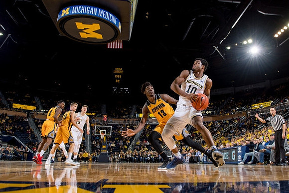 Moritz Wagner (13) and Derrick Walton Jr. (10)