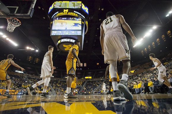 Moritz Wagner (13), Zak Irvin (21), and D.J. Wilson (5)