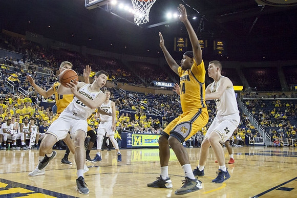 Sean Lonergan (20), Duncan Robinson (22), and Moritz Wagner (13)