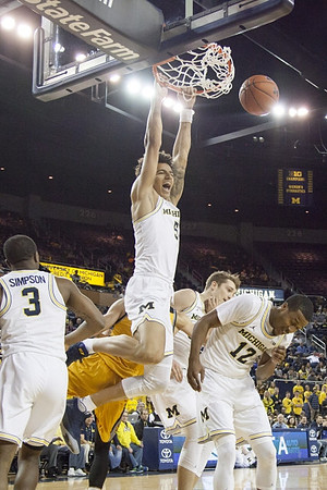 Xavier Simpson (3), D.J. Wilson (5), Mark Donnal (34), and Muhammad-Ali Abdur-Rahkman (12)