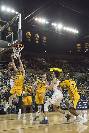 Derrick Walton Jr. (10) and D.J. Wilson (5)