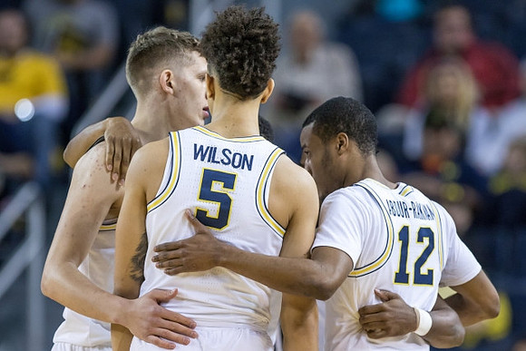 Moritz Wagner (13), D.J. Wilson (5), and Muhammad-Ali Abdur-Rahkman (12)