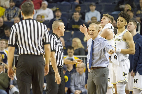 John Beilein, Moritz Wagner (13), and D.J. Wilson (5)
