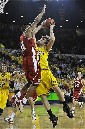 Jordan Morgan (52) and Zack Novak (0)
