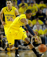 Jordan Morgan (52) and Darius Morris (4)