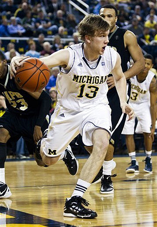 Matt Vogrich (13) and Trey Burke (3)