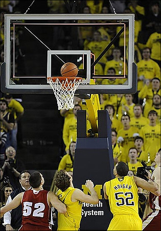 Zack Novak (0) and Jordan Morgan (52)