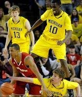 Matt Vogrich (13), Tim Hardaway Jr. (10), and Evan Smotrycz (23)