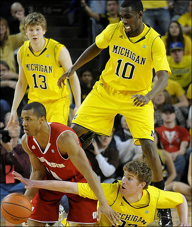 Matt Vogrich (13), Tim Hardaway Jr. (10), and Evan Smotrycz (23)