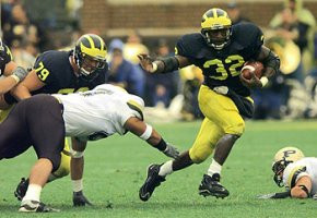Anthony Thomas (32) and Jeff Backus (79)
