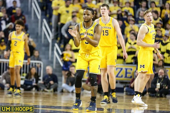 Jordan Poole (2), Zavier Simpson (3), Jon Teske (15), and Ignas Brazdeikis (13)
