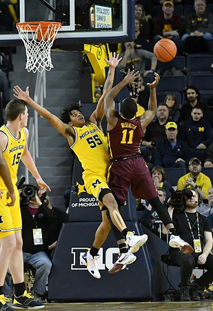 Eli Brooks (55) and Jon Teske (15)