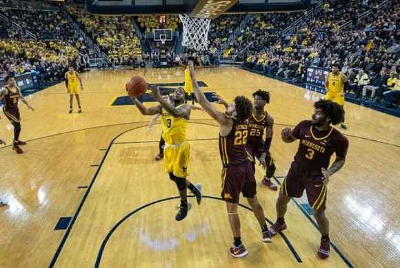 Jordan Poole (2), Zavier Simpson (3), Charles Matthews (1), and Isaiah Livers (4)
