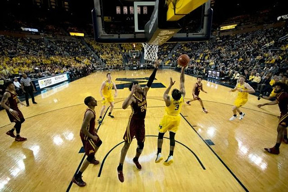 Jon Teske (15), Zavier Simpson (3), and Ignas Brazdeikis (13)