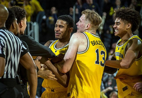Charles Matthews (1), Ignas Brazdeikis (13), and Jordan Poole (2)