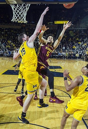 Jon Teske (15) and Jordan Poole (2)
