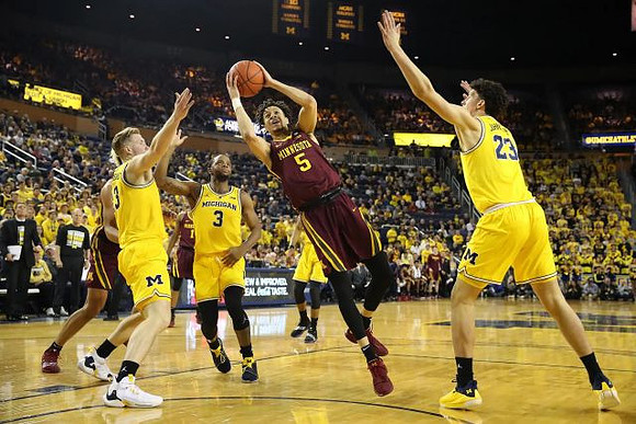 Ignas Brazdeikis (13), Zavier Simpson (3), and Brandon Johns Jr. (23)