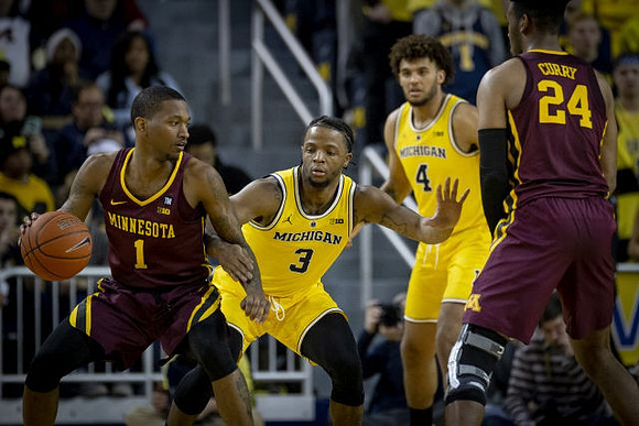Zavier Simpson (3) and Isaiah Livers (4)